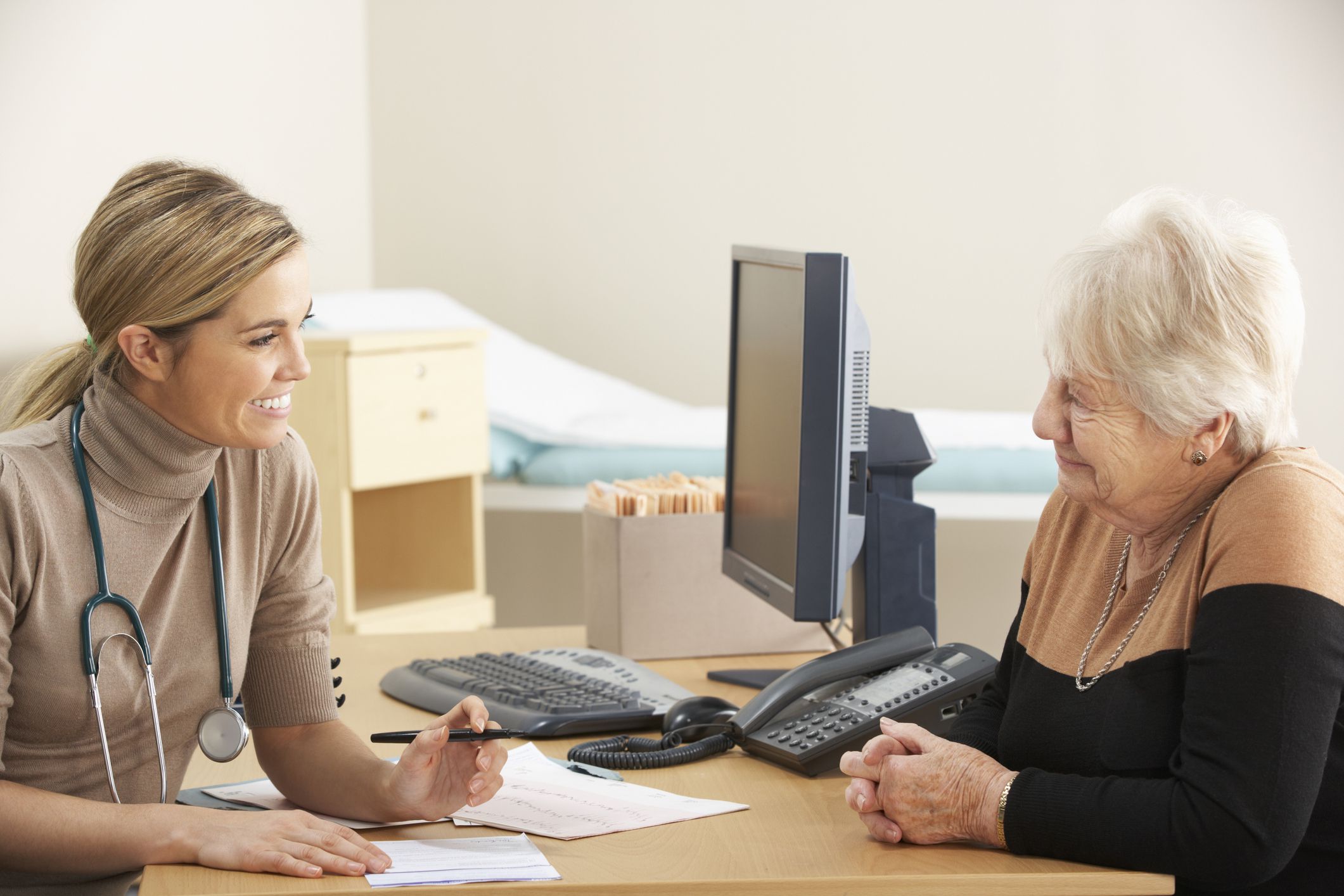 A female doctor talking to a female patient about a prescription