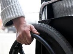 Pushing a wheelchair closeup