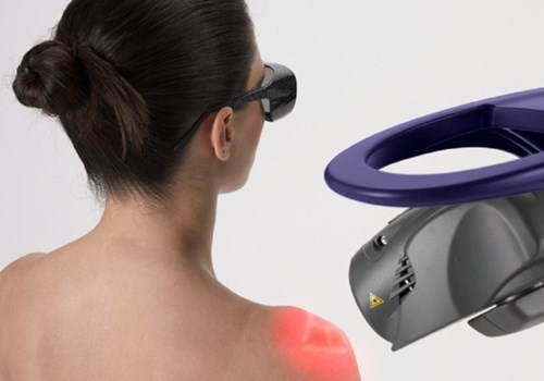 A woman undergoing laser therapy while wearing protective glasses