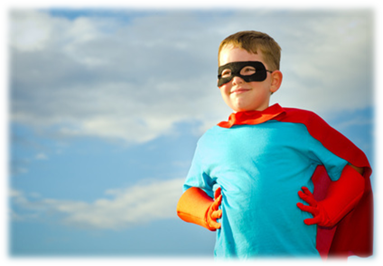 A child wearing a super hero outfit with his hands on his hips